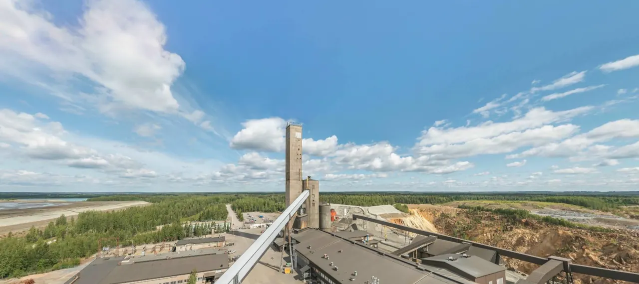 Pyhäsalmi mine concentrator and headframe on a summer day