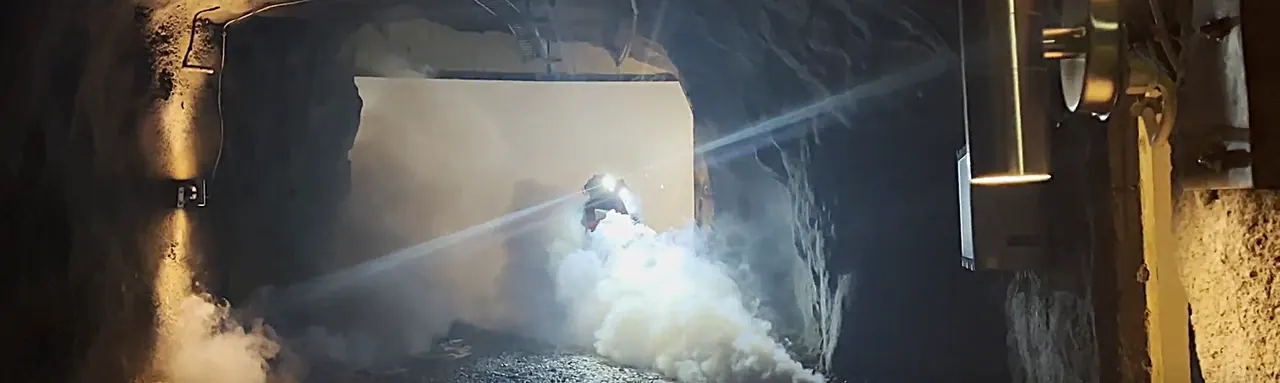 Rescue exercise in smoke in an underground mine tunnel